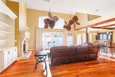 Large great room overlooks scenic canal in backyar