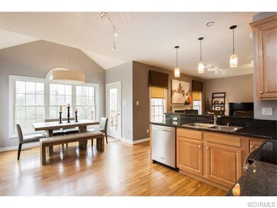 Kitchen looking into breakfast nook and great room