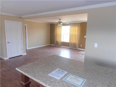 View of the island in the kitchen looking into the living room
