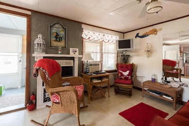 Living room has a gas fireplace and...