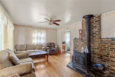 Living room with hardwood / wood-style floors, a w