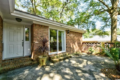 Exterior space featuring brick siding