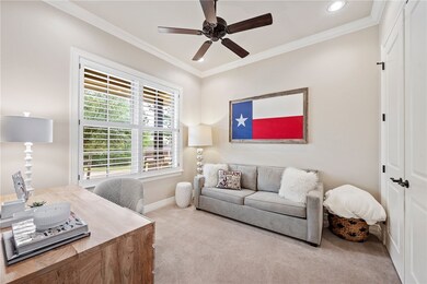 Office space featuring carpet floors, a ceiling fa