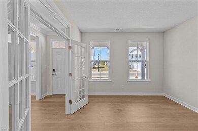 Flex Room w/glass french doors & transom window