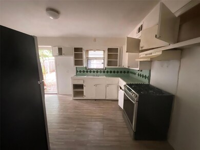Kitchen featuring a wealth of natural light, stain