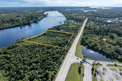 Aerial overview of property's location featuring a nearby body of water and property boundaries highlighted