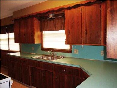There is a window above the kitchen sink
