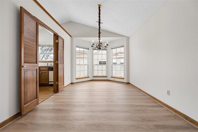 Dining area with bay window. Entrance to kitchen o