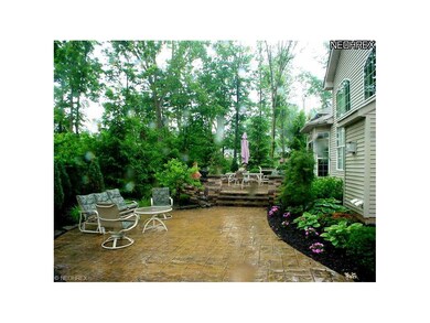 Serene and private back yard with two-level stampe