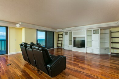 The living room offers access to the expansive bal