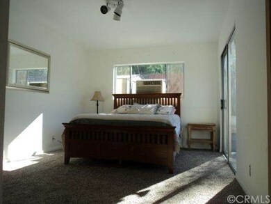 BEDROOM #1 WITH SLIDING DOORS THAT GO OUT TO BACK 