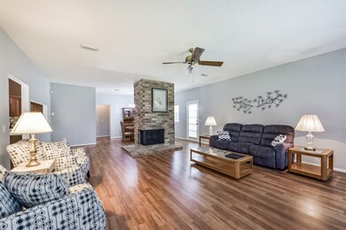 Spacious living room with hardwood floors, featuri