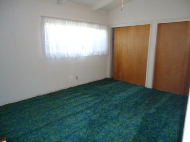 This spare bedroom has lots of closet space.