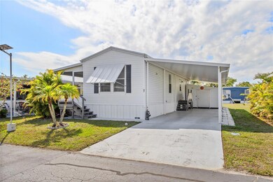 Front view, large covered carport