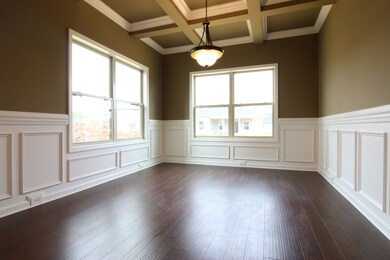 EXAMPLE>>>Elegant Formal Dining Room with Coffered Ceiling, LOTS of Custom Trim and Wood Flooring!!!
