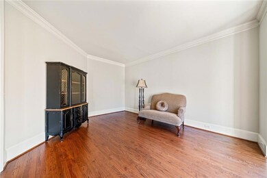 Unfurnished room featuring ornamental molding, bas
