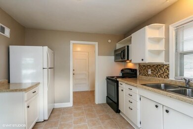 Across Kitchen in to Laundry Room