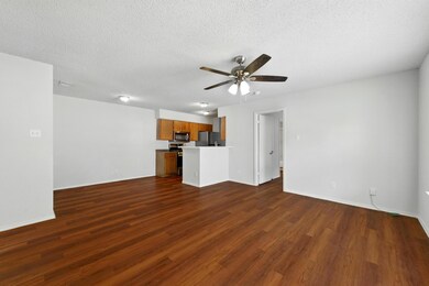 Unfurnished living room featuring ceiling fan, da