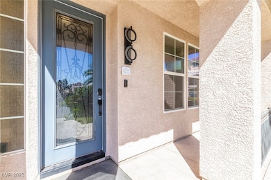 View of exterior entry featuring stucco siding