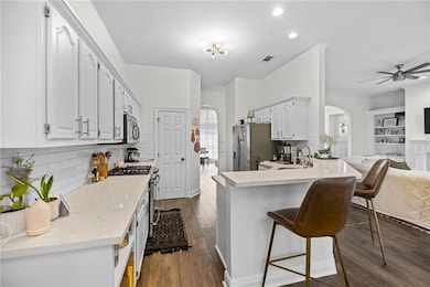 Kitchen over looks breakfast nook & living room