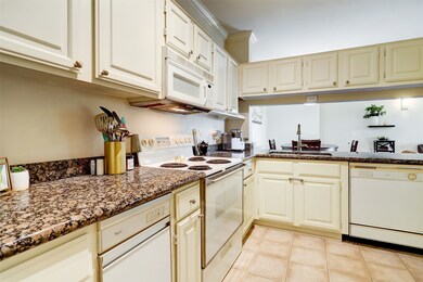 The kitchen offers an abundance of storage.