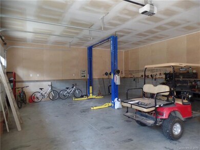 Huge garage with installed auto lift