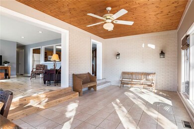 Gorgeous Sun room as you enter from the driveway.