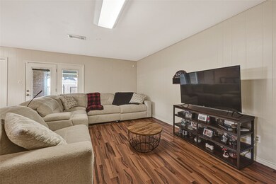 Bright living space with clean lines, hardwood floors, and a comfortable modern layout.