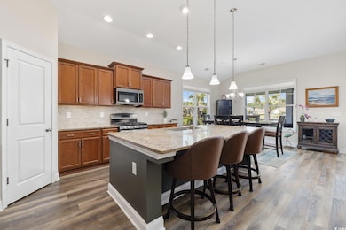Kitchen featuring wood finished floors, a kitchen 