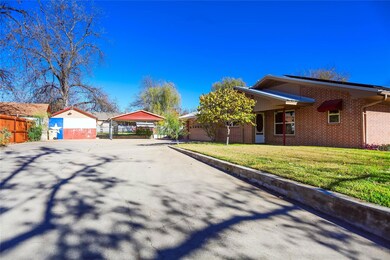 View of front of house with a carport, a garage, a