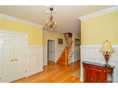 Stunning Foyer with Judges Paneling.