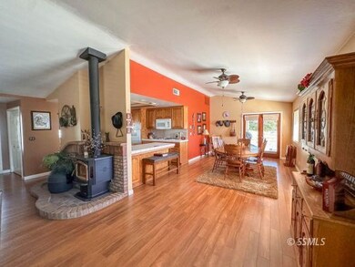 LIVING ROOM LOOKING INTO DINING