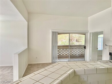 Unfurnished bedroom featuring access to outside and carpet