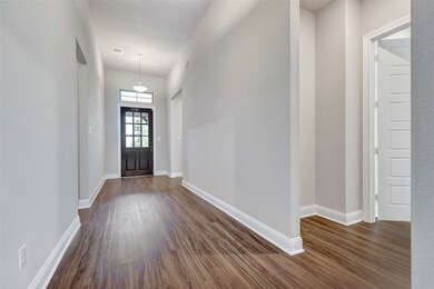 Bright and spacious hallway with lightly tinted wa