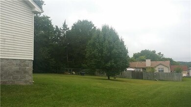 WOW!! What a park like back yard with dog pen.   Large enough for a picnic or football game.