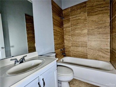 Full bathroom with vanity, toilet, and shower / washtub combination