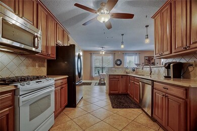 Spacious kitchen with quartz counter tops.