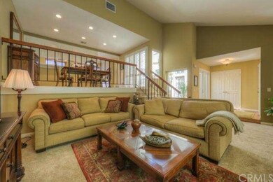 Spacious living room with atrium in the back groun