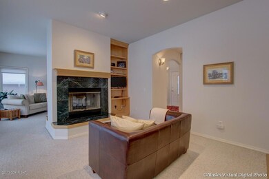 Fam Rm w/Fireplace & Bookshelves
