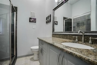 Full bathroom featuring visible vents, toilet, van