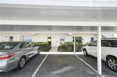 Condo Exterior Entry and Covered Parking Area