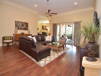Spacious den with 12' ceilings and hickory wood en