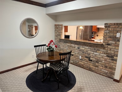 Dining room with brick wall under breakfast bar