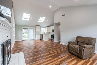 Living room opens to kitchen:dining