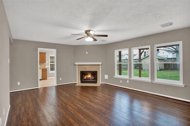 Corner fireplace with convenient gas logs.
