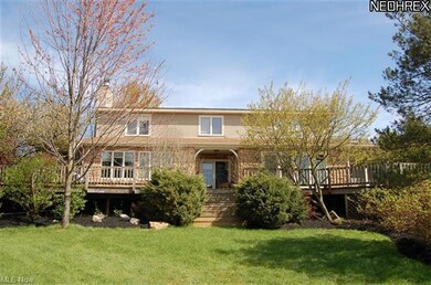 BACK OF HOME WITH BEAUTIFUL DECKING