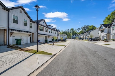 View of road with a residential view, street light