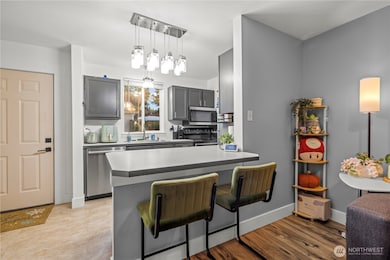 The peninsula island includes space for two seats, making it easy to serve guests and create a comfortable spot for entertaining while staying connected to the main living area.