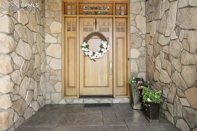 Elegant entry covered front porch leading to your Colorado oasis!