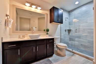 Walk in shower with floor to ceiling tile. If ther